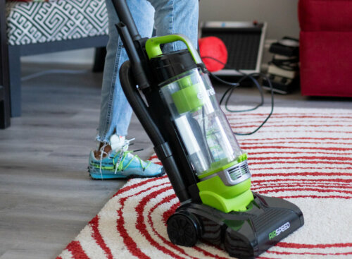 carpet cleaning marketing strategies - woman vacuuming rug