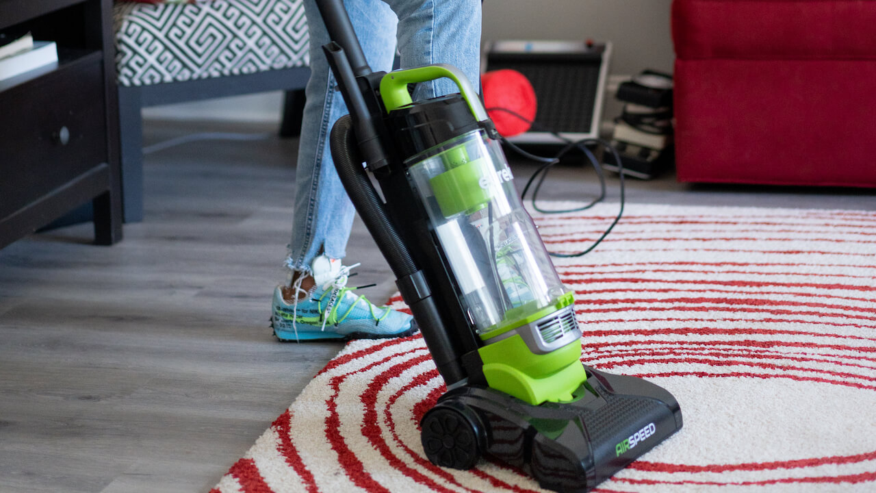 carpet cleaning marketing strategies - woman vacuuming rug