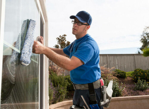 Man cleaning a window