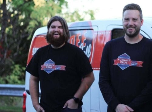 HVAC team standing in front of a truck