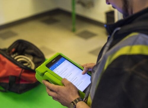 Contractor holding tablet for free estimates