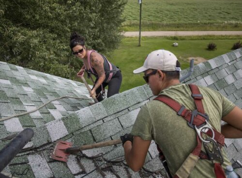 Home contractors working on a roof