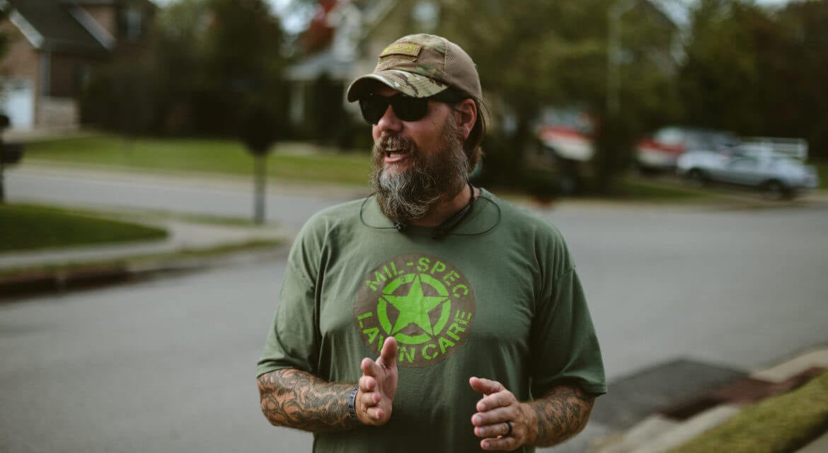 Landscaper salary guide - landscaping professional in uniform