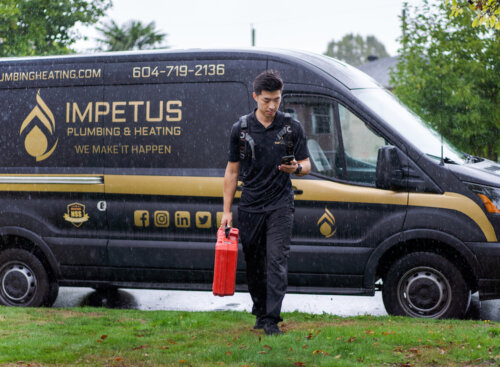Man walking near a work van
