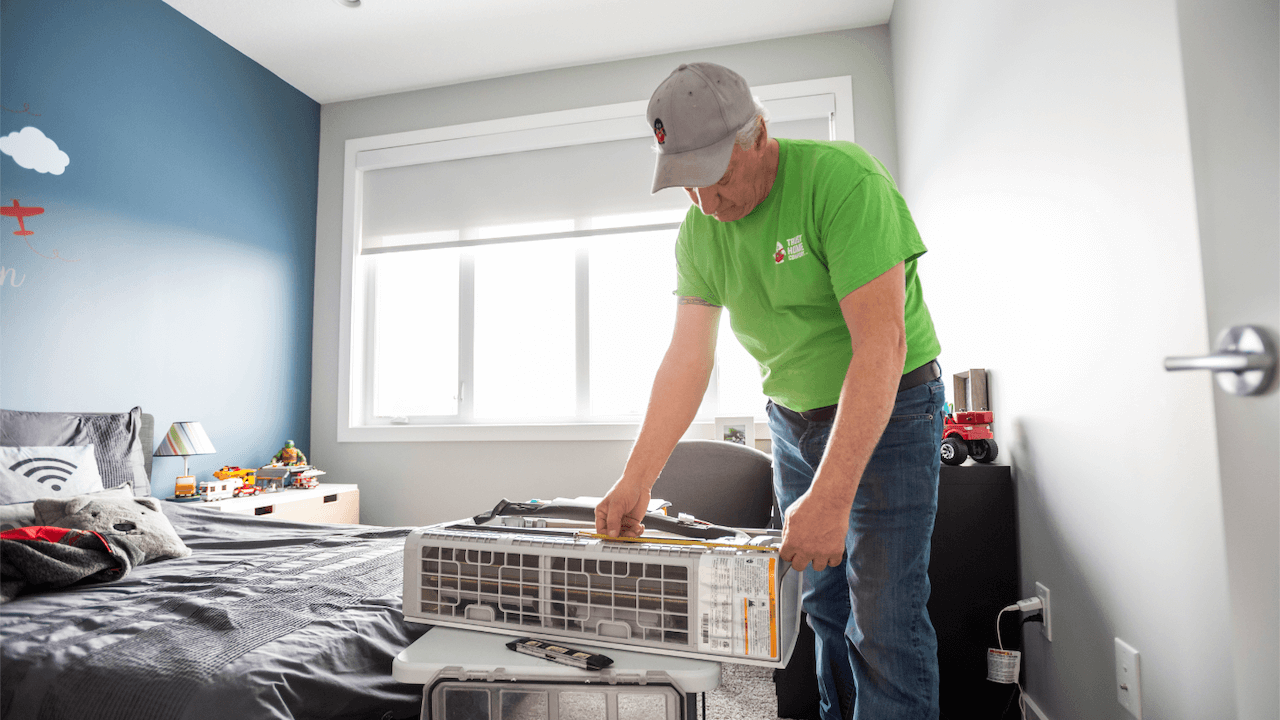 image of an HVAC contractor repairing a home air conditioning unit