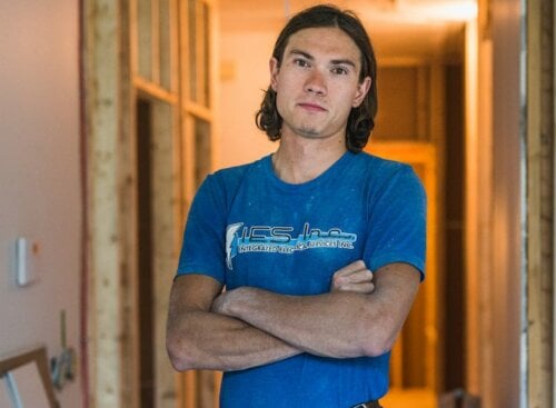 image of an electrician with his arms folded