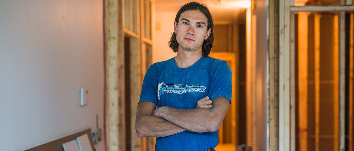 image of an electrician with his arms folded