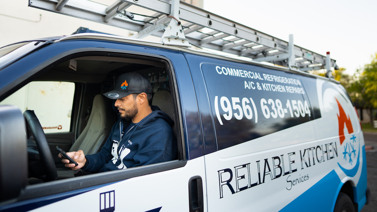 Photo of an HVAC contractor using HVAC marketing on his company van