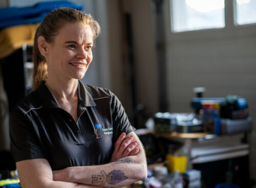 Photo of an HVAC business owner smiling and giving HVAC sales tips to a crew