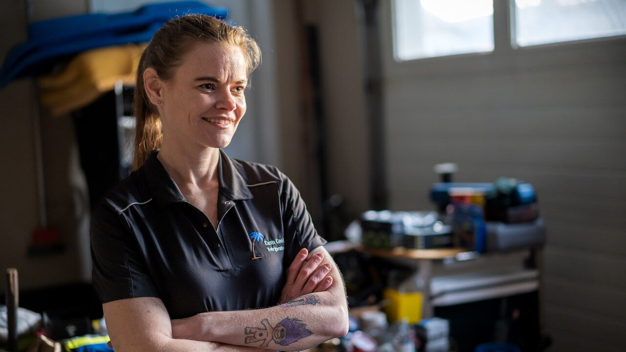 Photo of an HVAC business owner smiling and giving HVAC sales tips to a crew