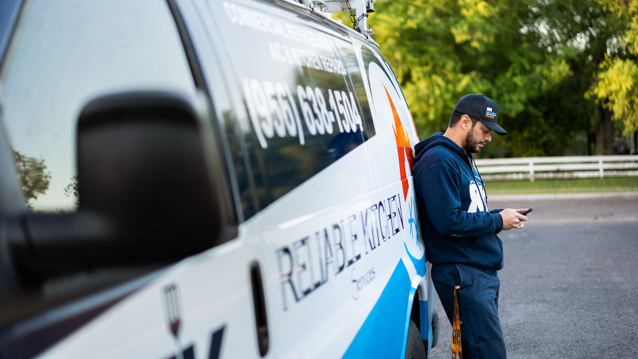 Photo of an HVAC contractor looking at his HVAC website design