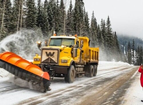 image of snow plow plowing a street