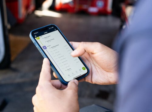 Photo of an HVAC company owner running his HVAC business using the Jobber mobile app