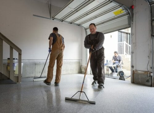 image of two service providers painting a floor