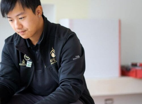 image of plumber on his mobile device