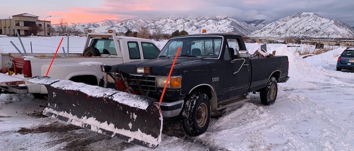 image of two snow plow trucks