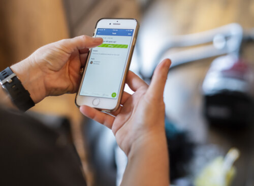 cleaner holding phone