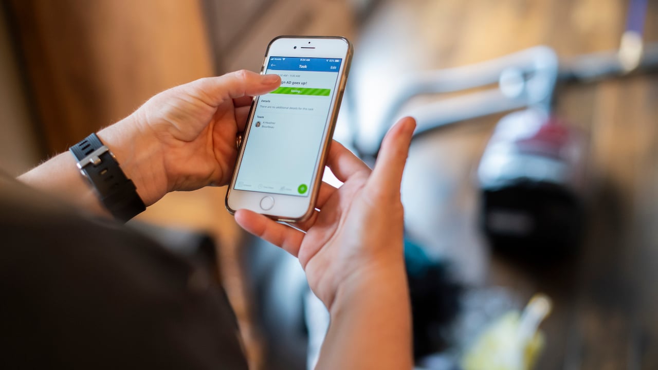 cleaner holding phone