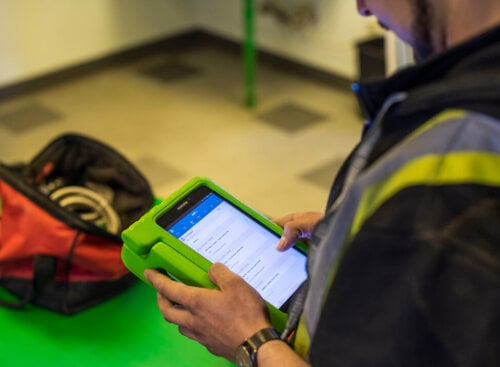 man holding tablet to write estimate
