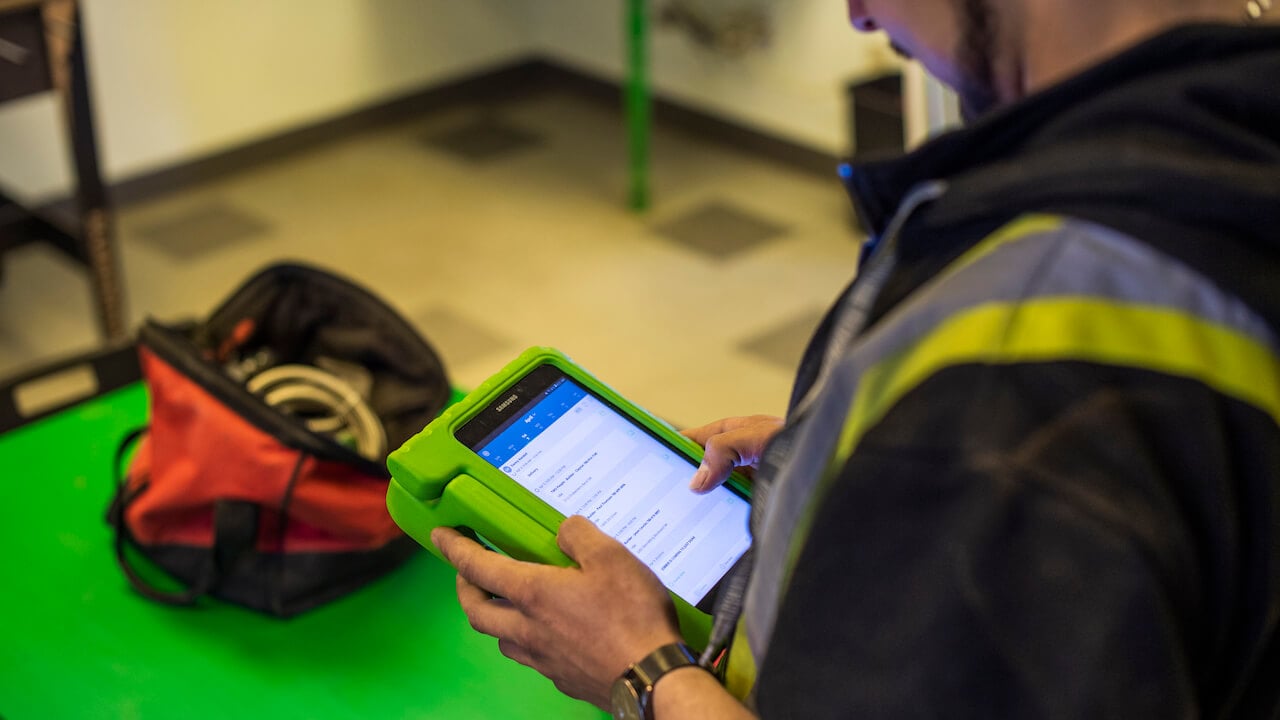 man holding tablet to write estimate