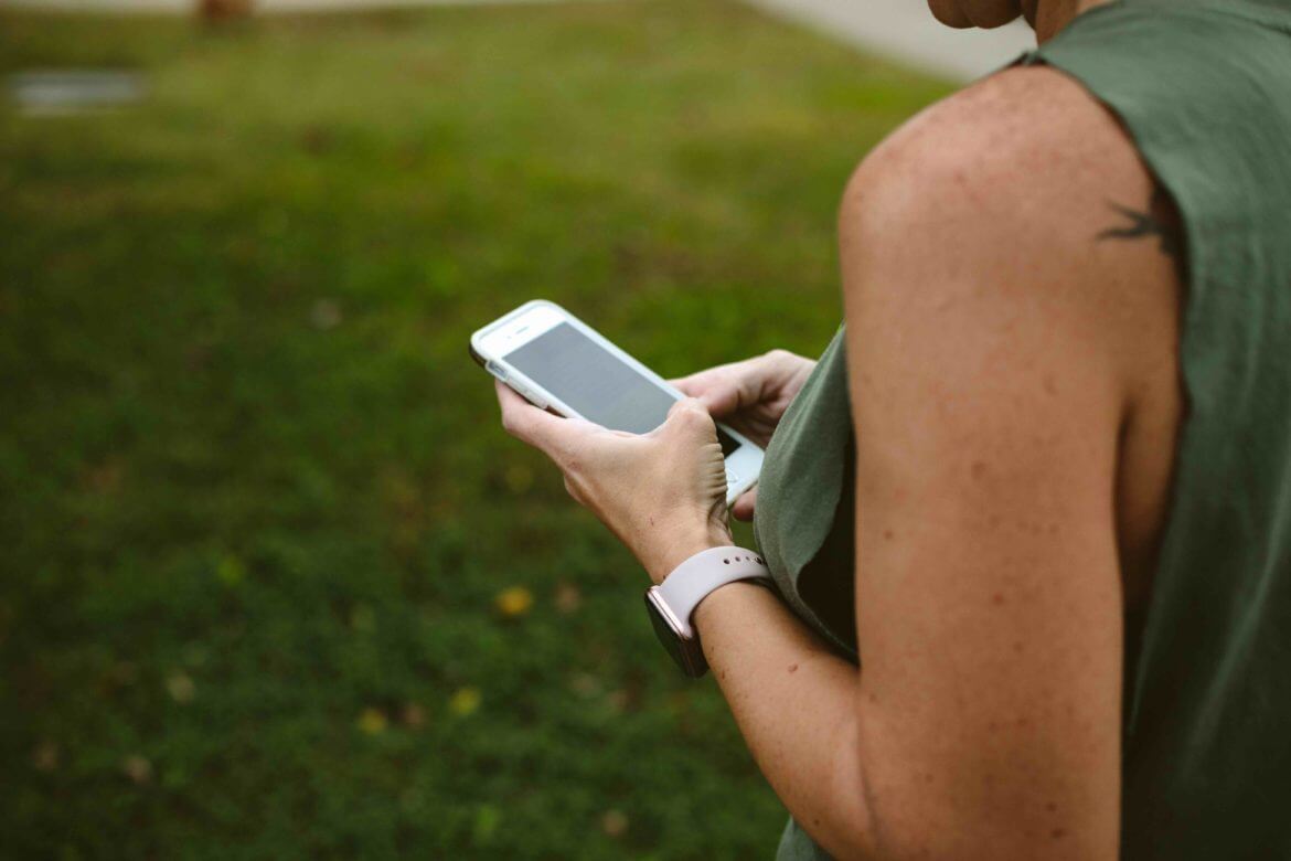 image of service provider working on her cell phone