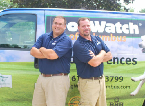 Photo of the team DogWatch of Columbus standing in front of a service van