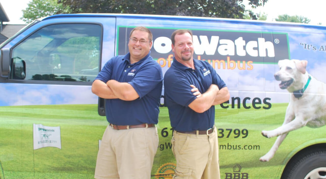 Photo of the team DogWatch of Columbus standing in front of a service van
