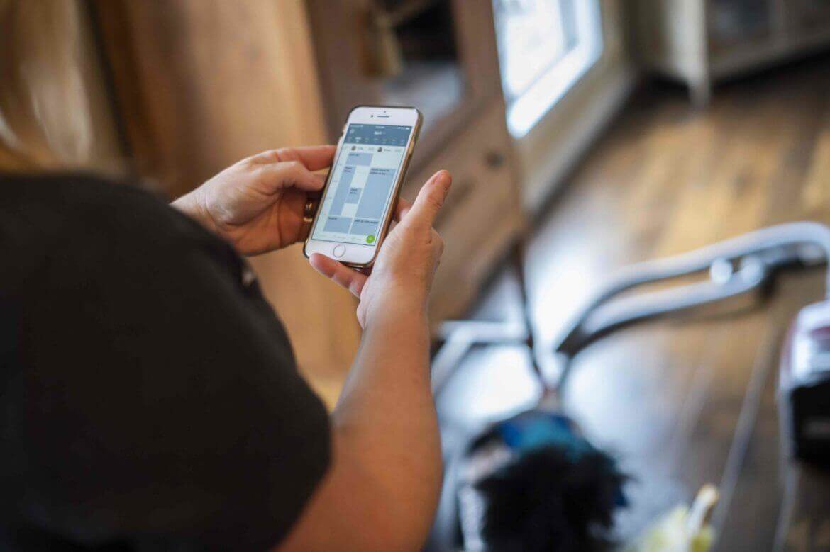 image of cleaning SP checking daily schedule on Jobber