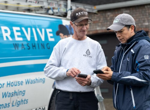 Photo of a home service contractor offering financing to a customer