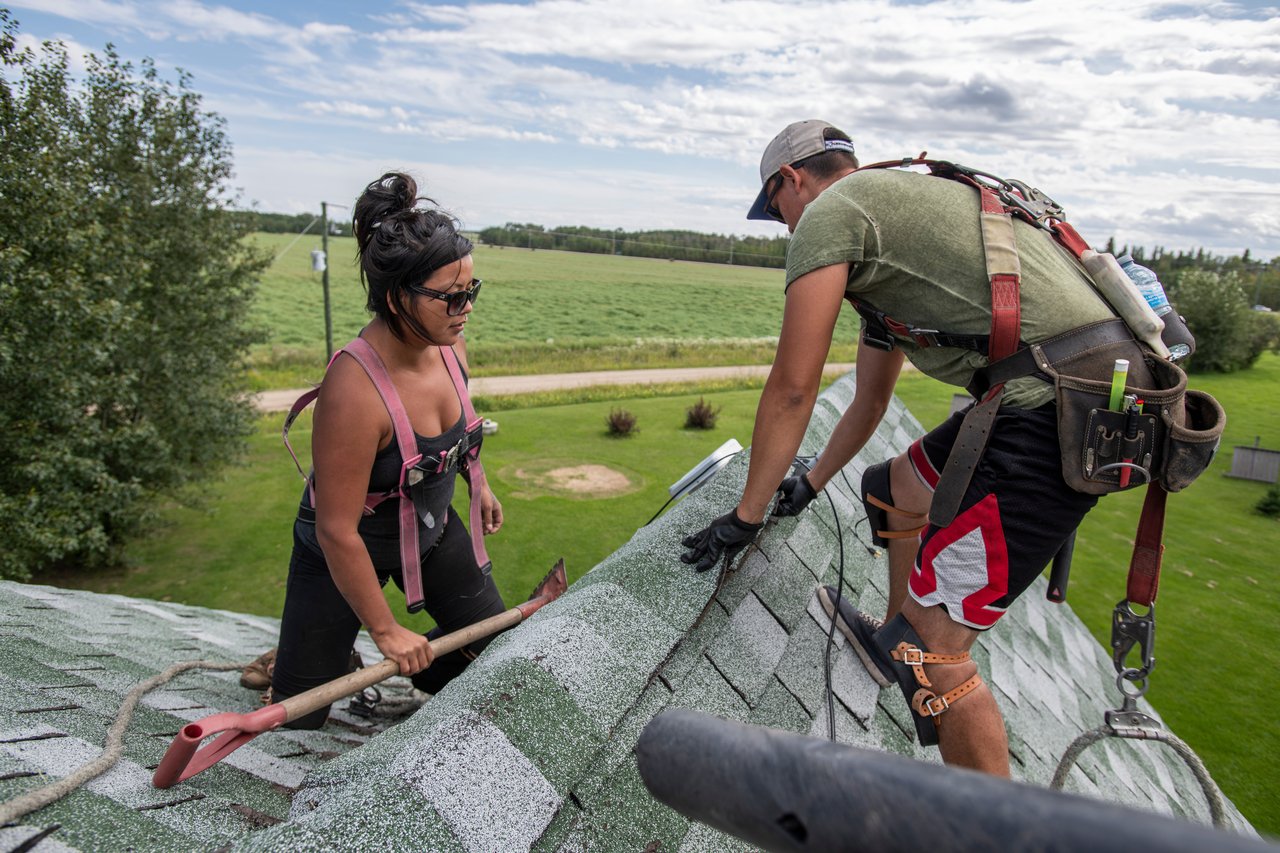 image of roofing contractors working on roof