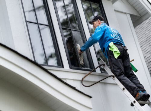 image of Revive Services washing a customer's window