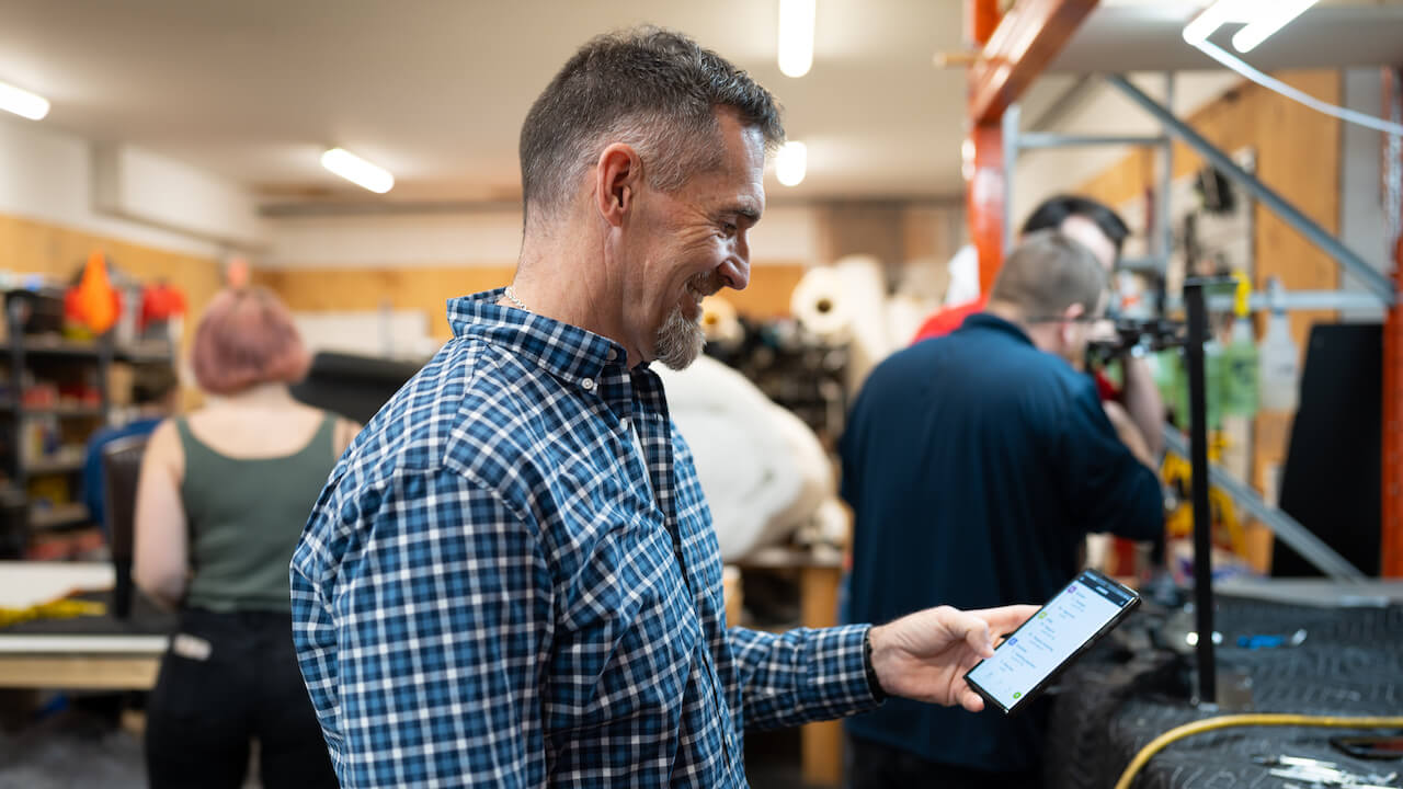 Small business owner using the best CRM apps to run his company