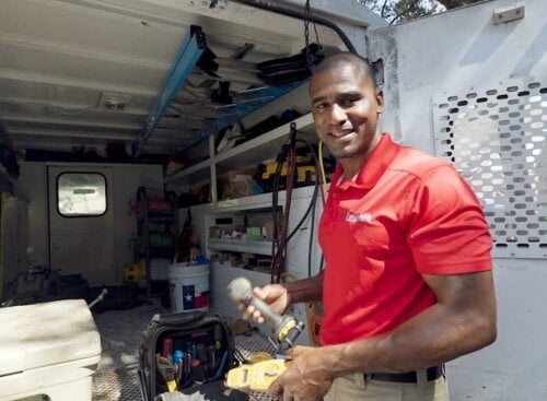 Walter Washington showing his HVAC van organization process