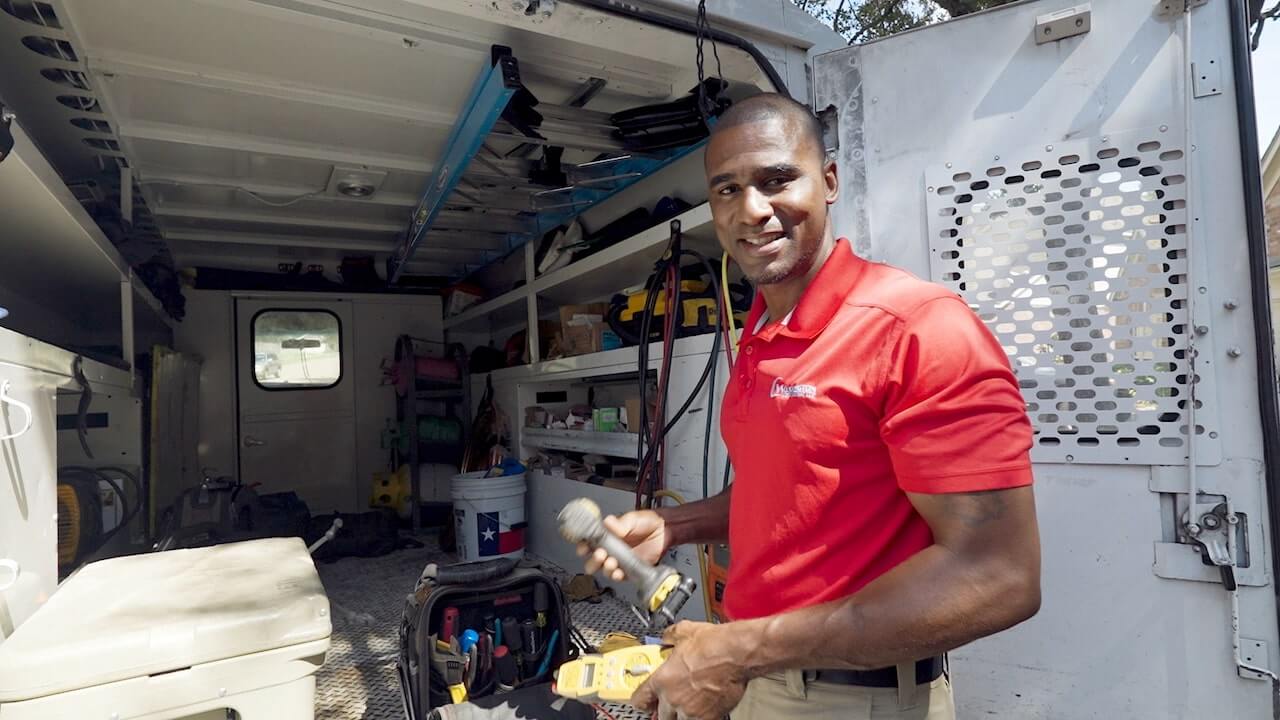 Walter Washington showing his HVAC van organization process