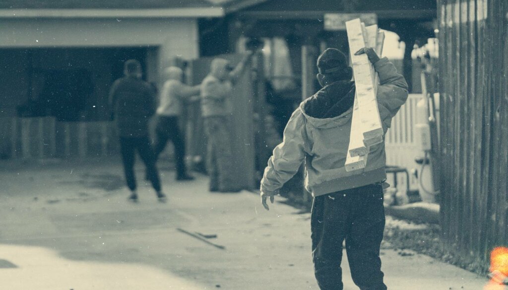 hero image of service provider carrying 2 x 4s