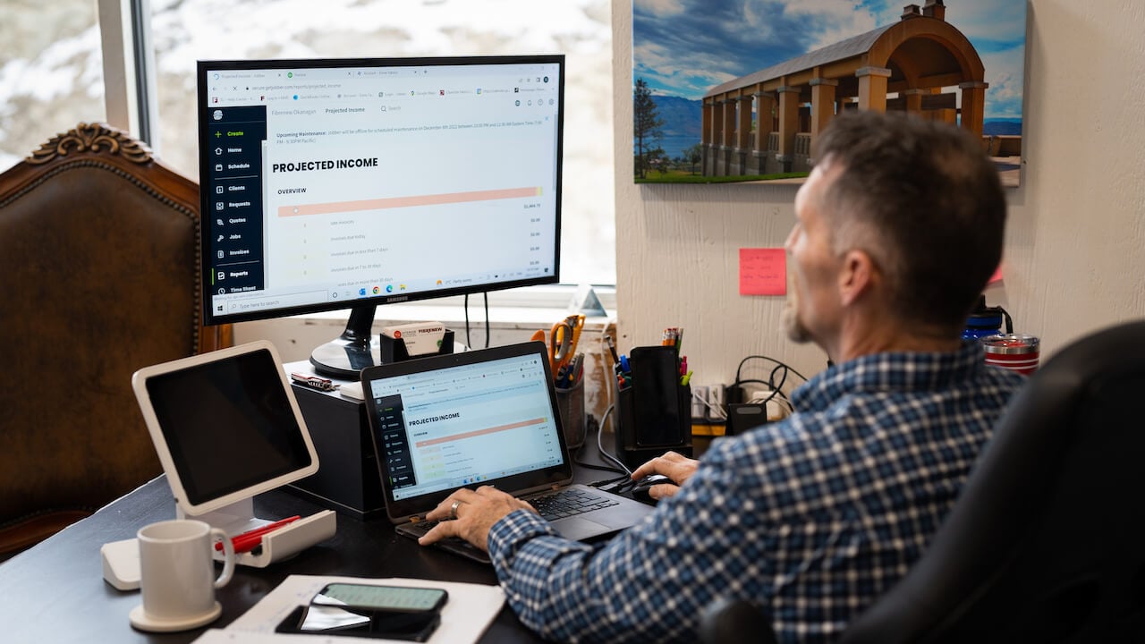 man working on small business budget