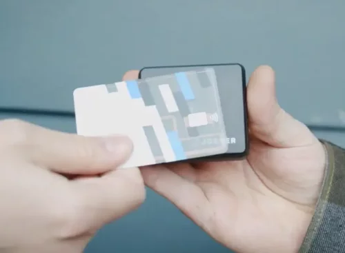 Business owner accepting a credit card payment with the Jobber Card Reader