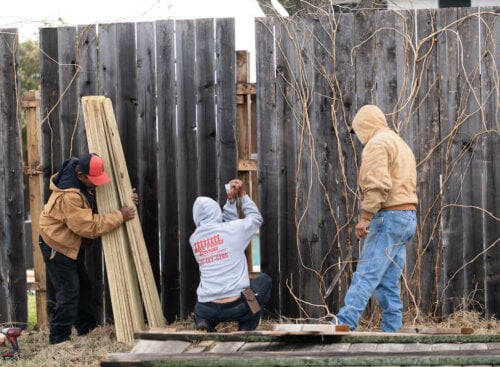 fencing contractors replacing a fence