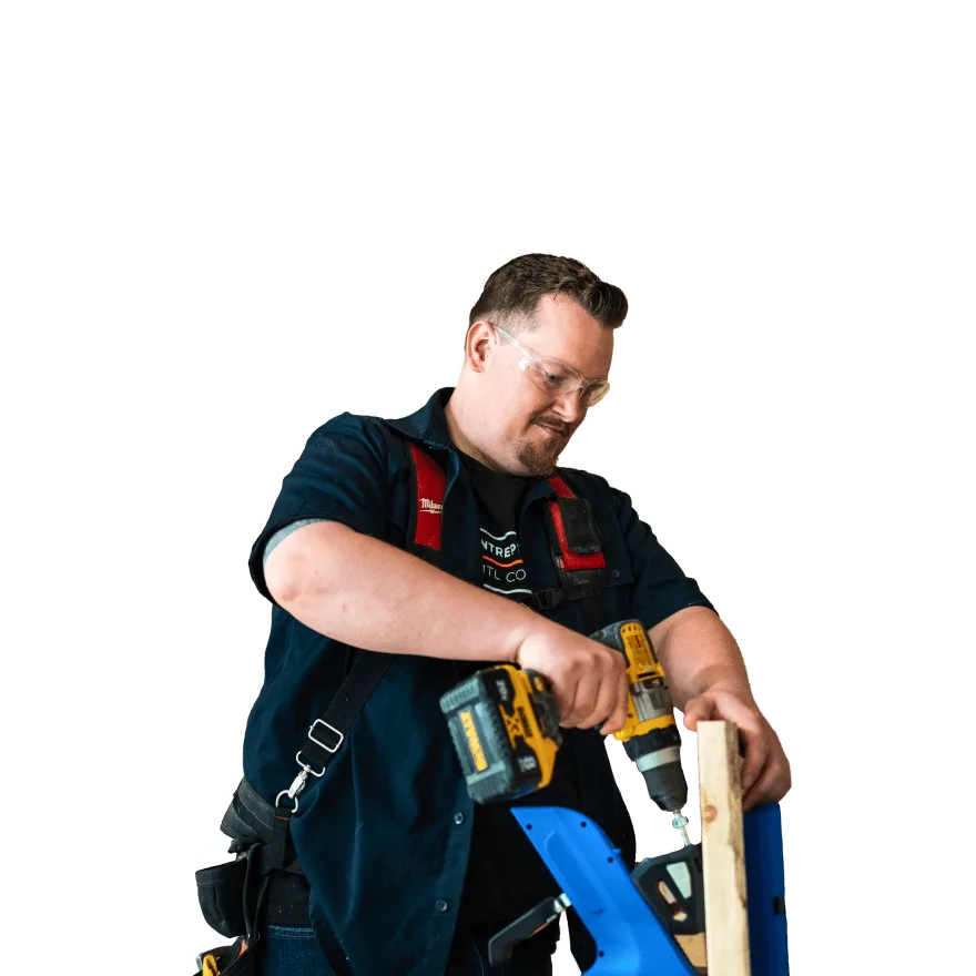 a man holding a drill