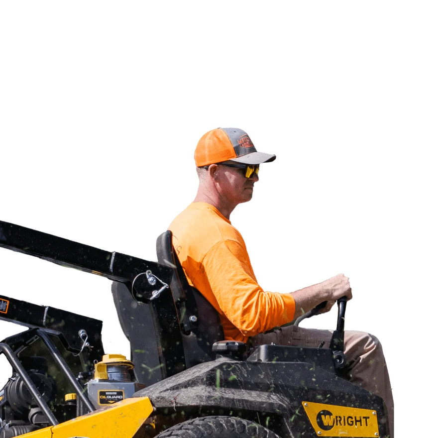 a man riding a lawn mower
