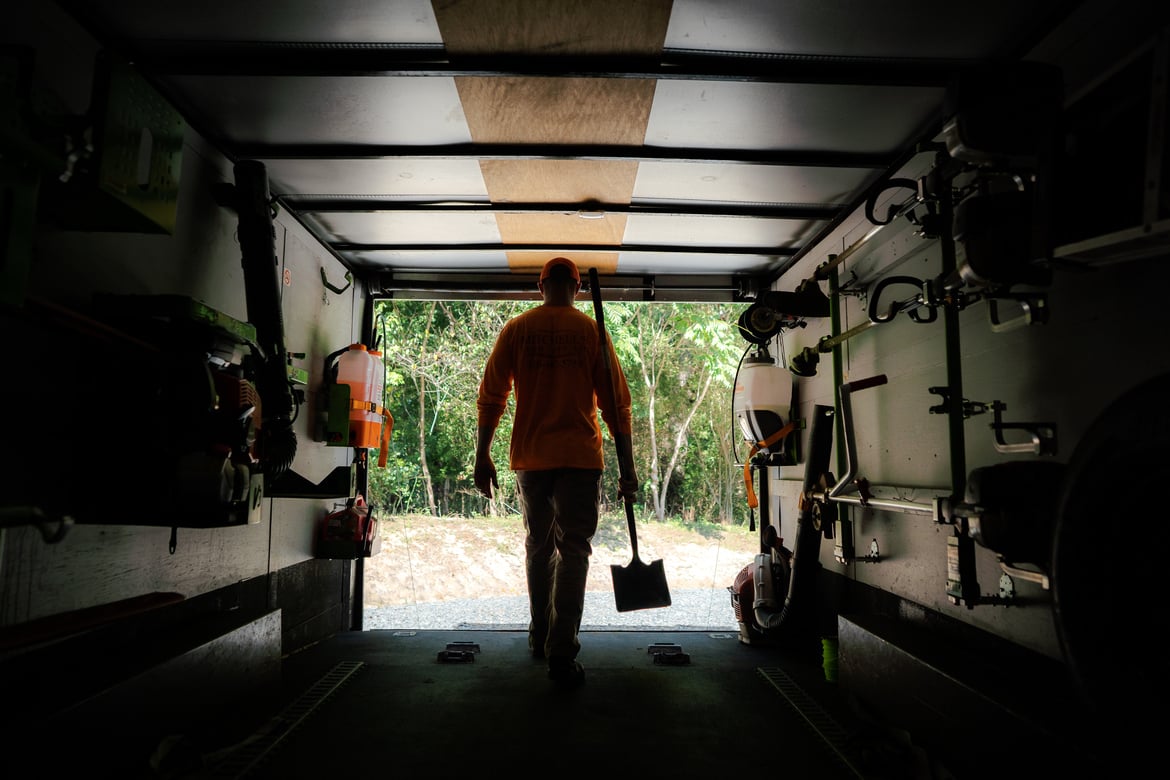 A lawn care worker leaving his truck for recurring services.