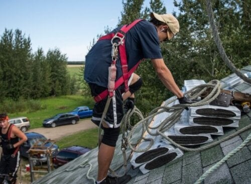 Roofing contractors working on a job