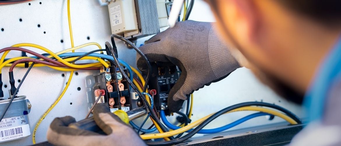 HVAC technician repairing a system