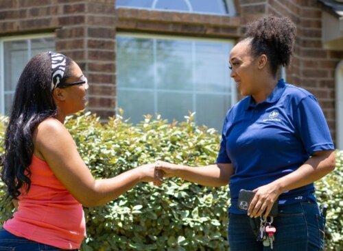 A business owner interacting with her client.