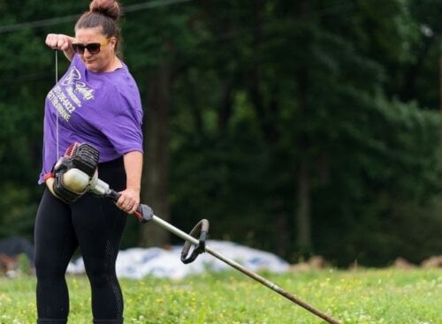 Lawn care technician starting up string trimmer