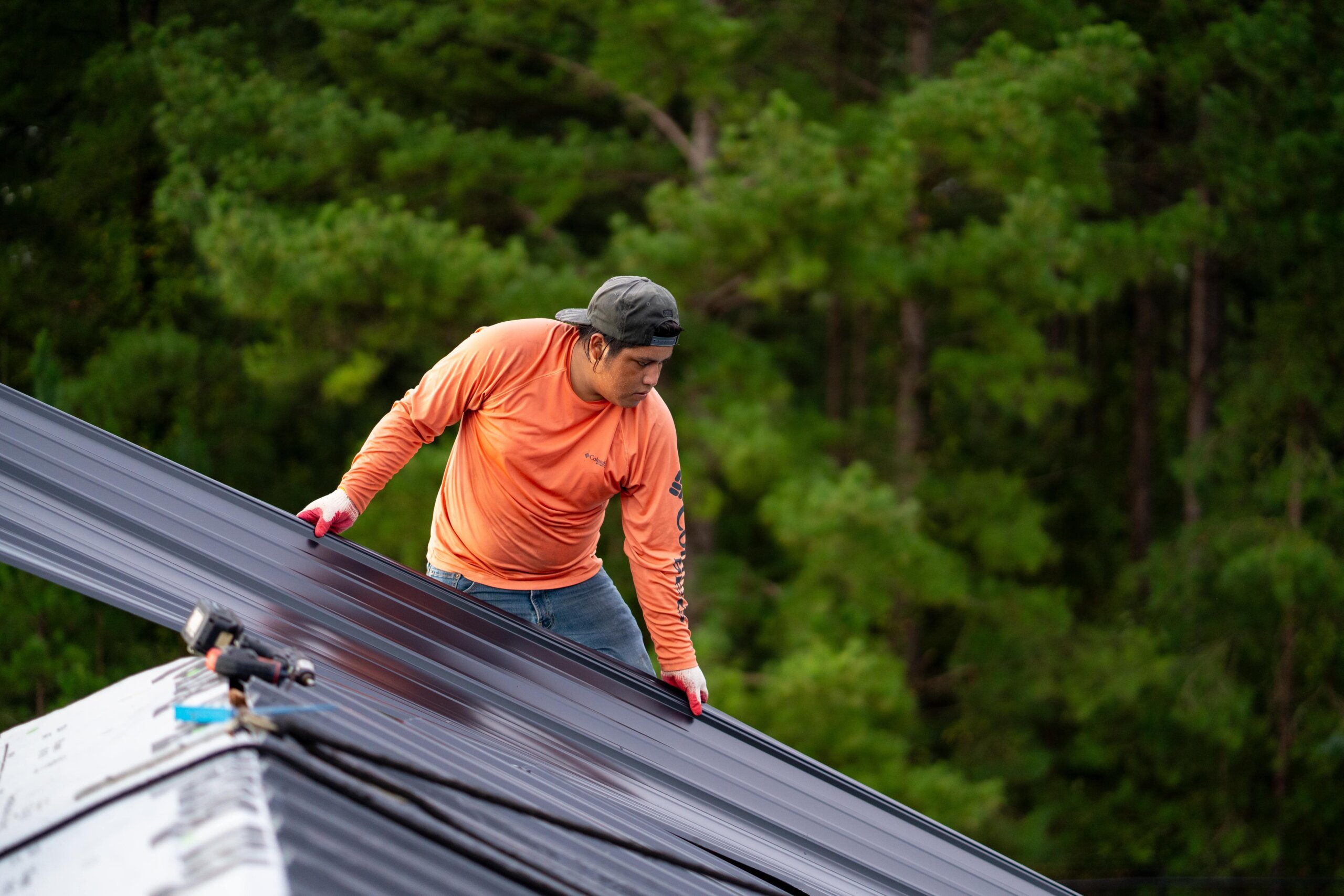 image of roofer laying materials.