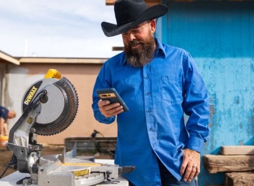 Construction/handy man service provider using software on their smartphone to manage business operations