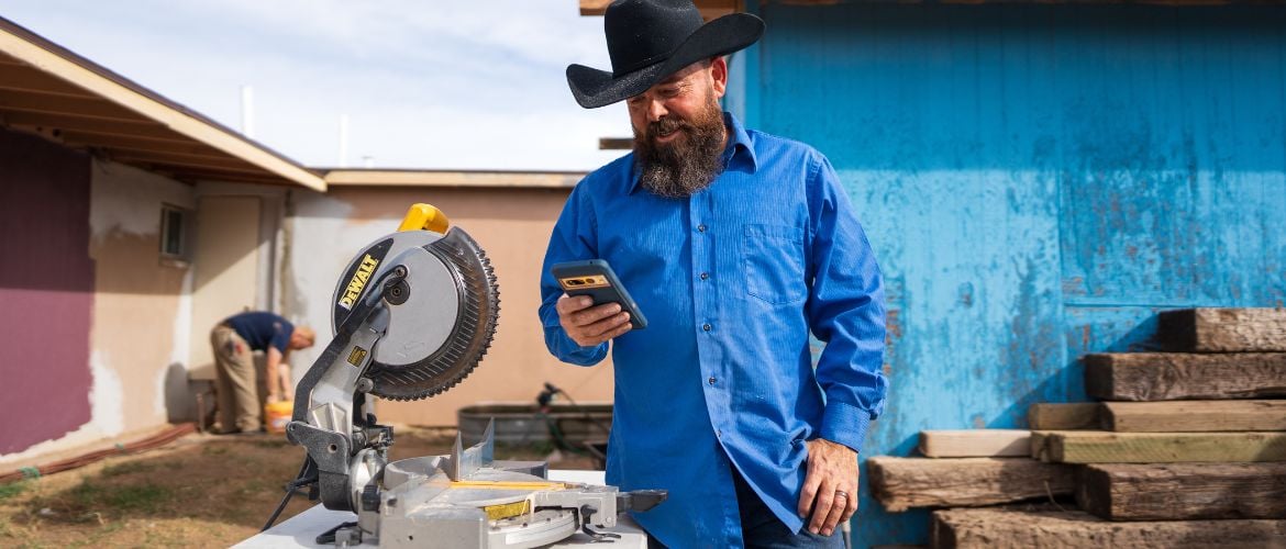Construction/handy man service provider using software on their smartphone to manage business operations
