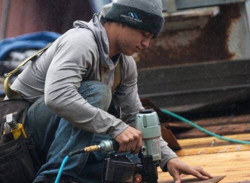 Roofer working on a roof replacement