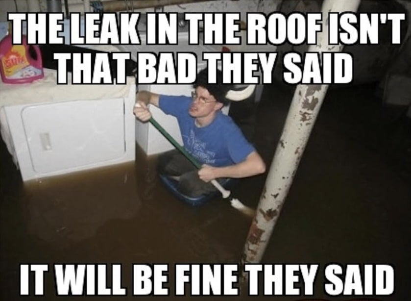 Person in a flooded basement, sitting in a plastic bin and paddling with a broom with roofing meme caption